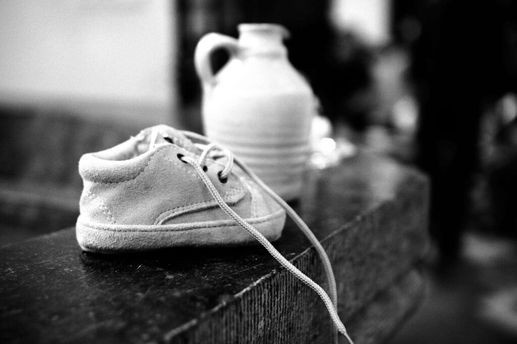 Picture of shoe at a baptism fountain.