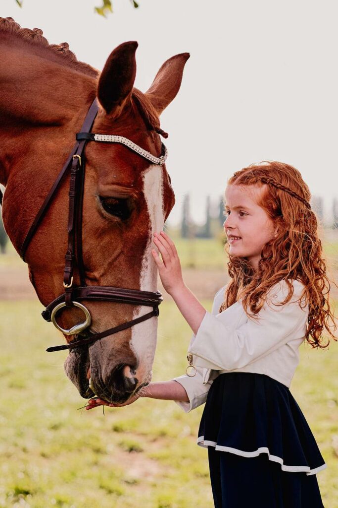 Girl posing with a horse