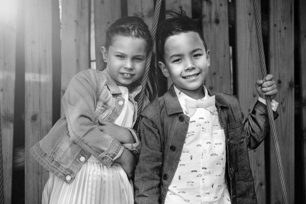 Portrait of a boy and girl posing two ropes.